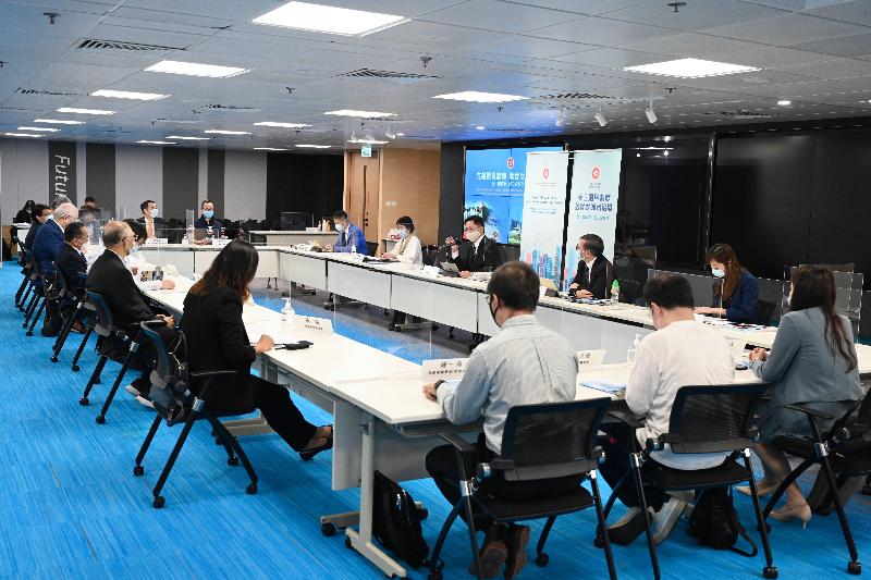 The Secretary for Innovation and Technology, Mr Alfred Sit (rear, third right), briefs the innovation and technology sector on the approval by the Standing Committee of the National People's Congress of the amended Annex I to the Basic Law on Method for the Selection of the Chief Executive of the Hong Kong Special Administrative Region and Annex II to the Basic Law on Method for the Formation of the Legislative Council of the Hong Kong Special Administrative Region and its Voting Procedures today (March 31) and listens to their views.