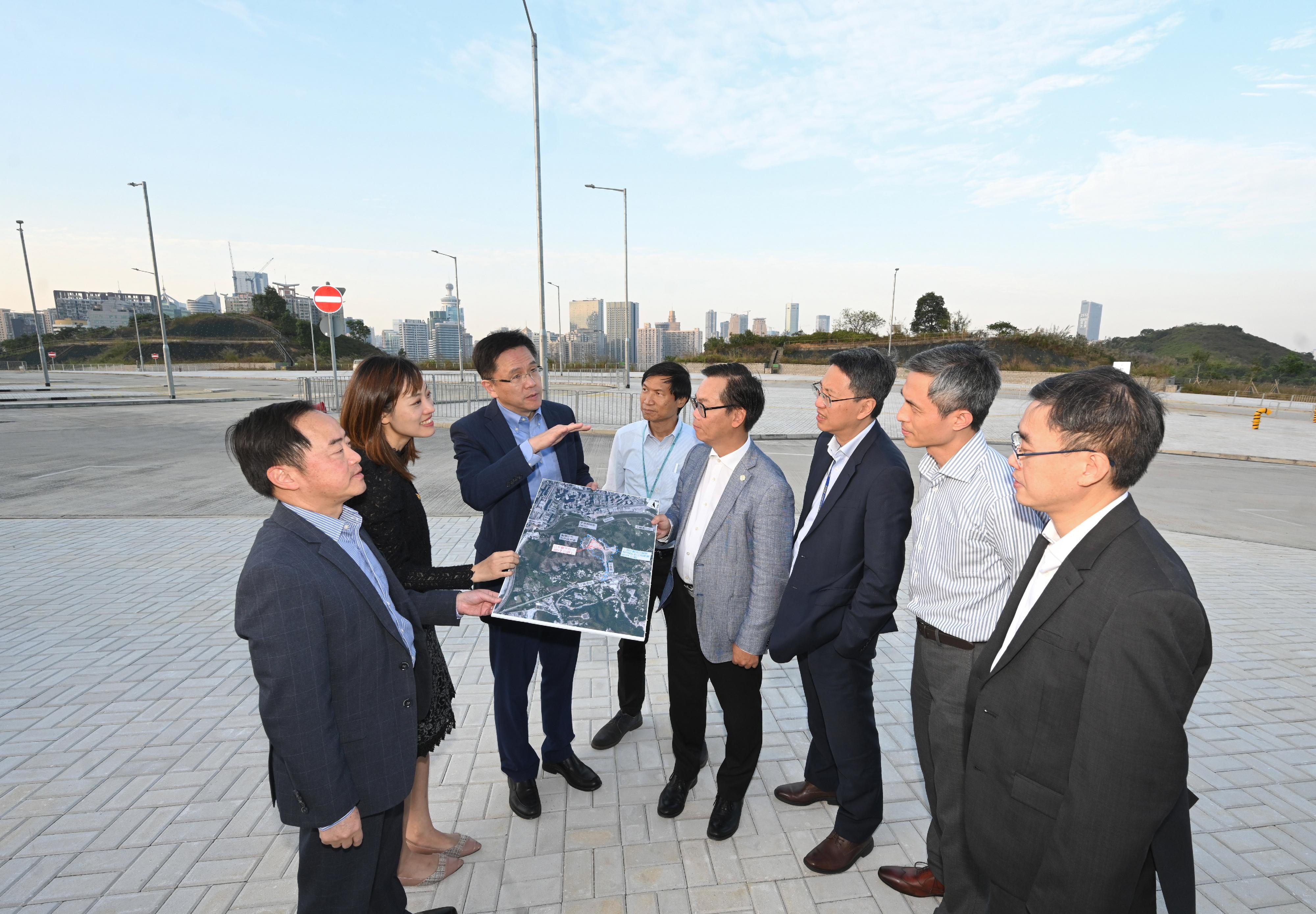 The Secretary for Innovation, Technology and Industry, Professor Sun Dong (third left), today (December 1) inspected a new site for innovation and technology (I&T) use in Sandy Ridge in North District. Accompanying him are the Permanent Secretary for Innovation, Technology and Industry, Mr Eddie Mak (third right); the Under Secretary for Innovation, Technology and Industry, Ms Lillian Cheong (second left); the Government Chief Information Officer, Mr Tony Wong (first left); the Director of the Northern Metropolis Co-ordination Office of the Development Bureau, Mr Vic Yau (second right); and the Acting Project Manager (North Development Office) of the Civil Engineering and Development Department, Mr Gavin Tse (fourth left).