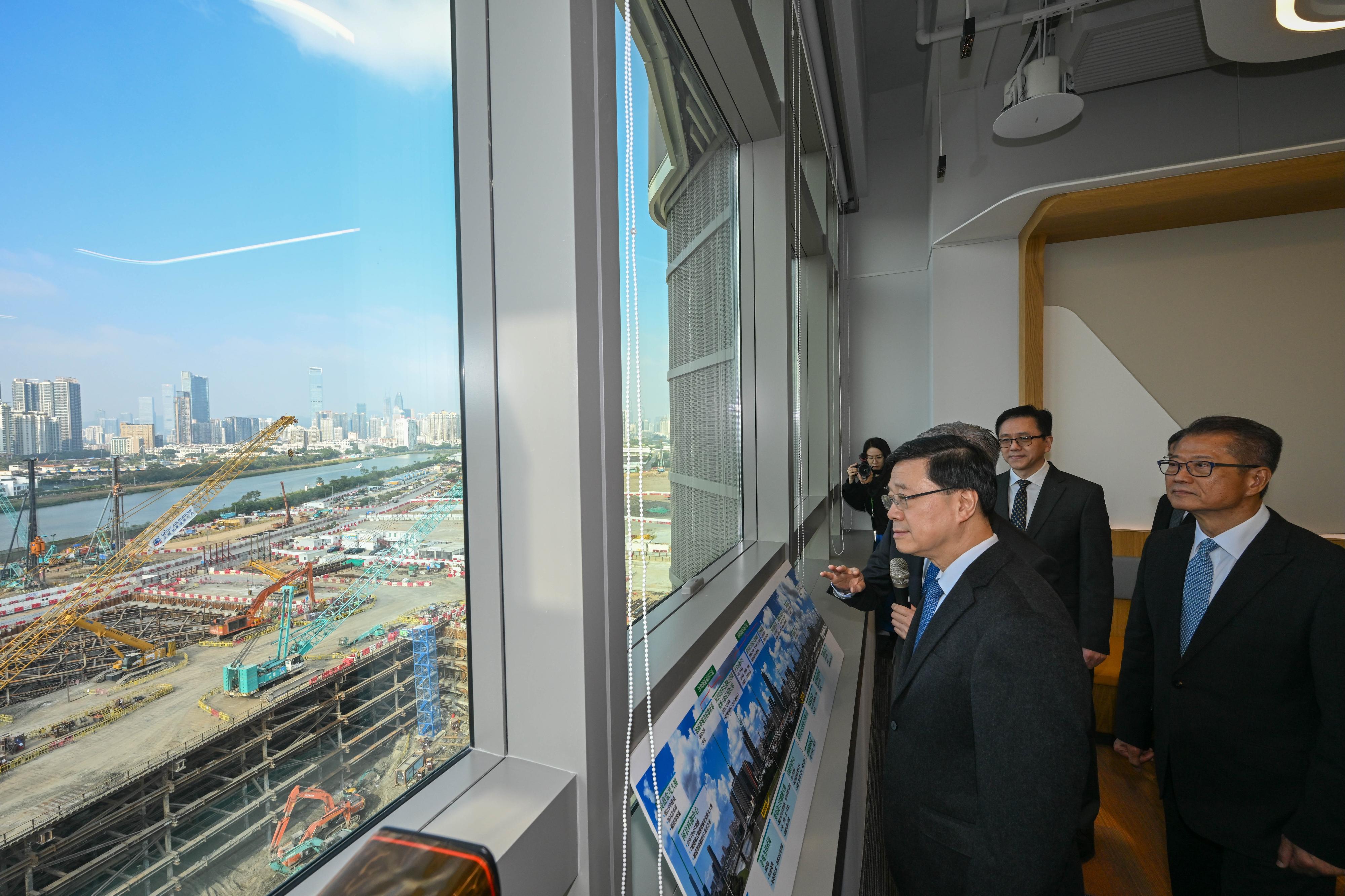 The Chief Executive, Mr John Lee, attended the Hong Kong-Shenzhen Innovation and Technology Park opening ceremony today (December 22). Photo shows Mr Lee (second right) listening to a briefing on Hetao Hong Kong Park and Shenzhen Park.